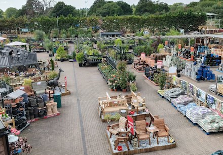 Longacres Bourne Valley aerial view of the outside of the store showing the stoneware department, shrubs and outdoor cafe seating area